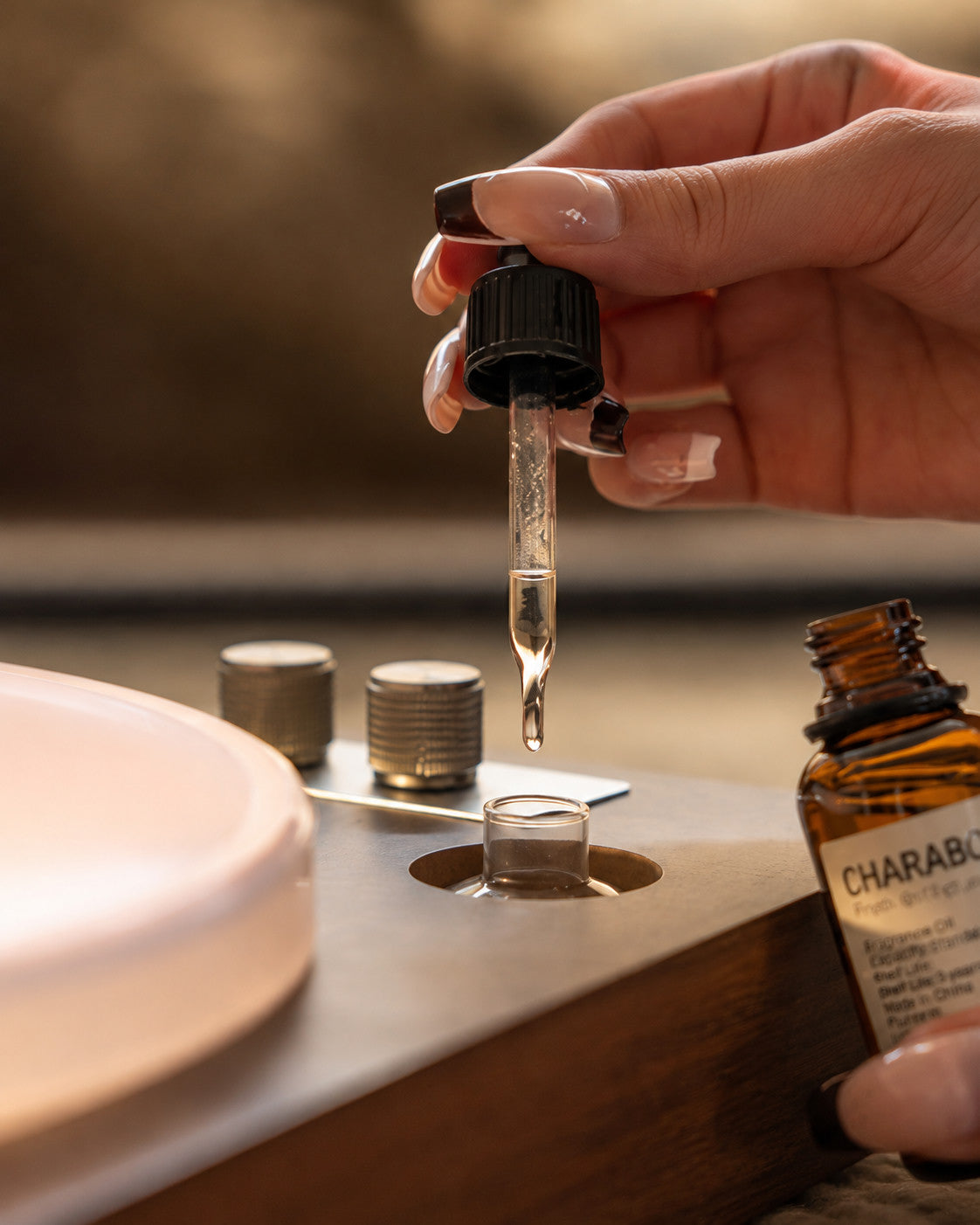 Adding pure essential oil with the glass dropper — no water