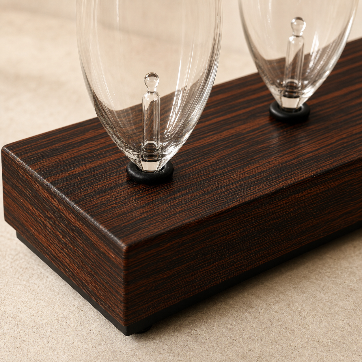 Close detail of the dark wood rack grain and glass bulb seats