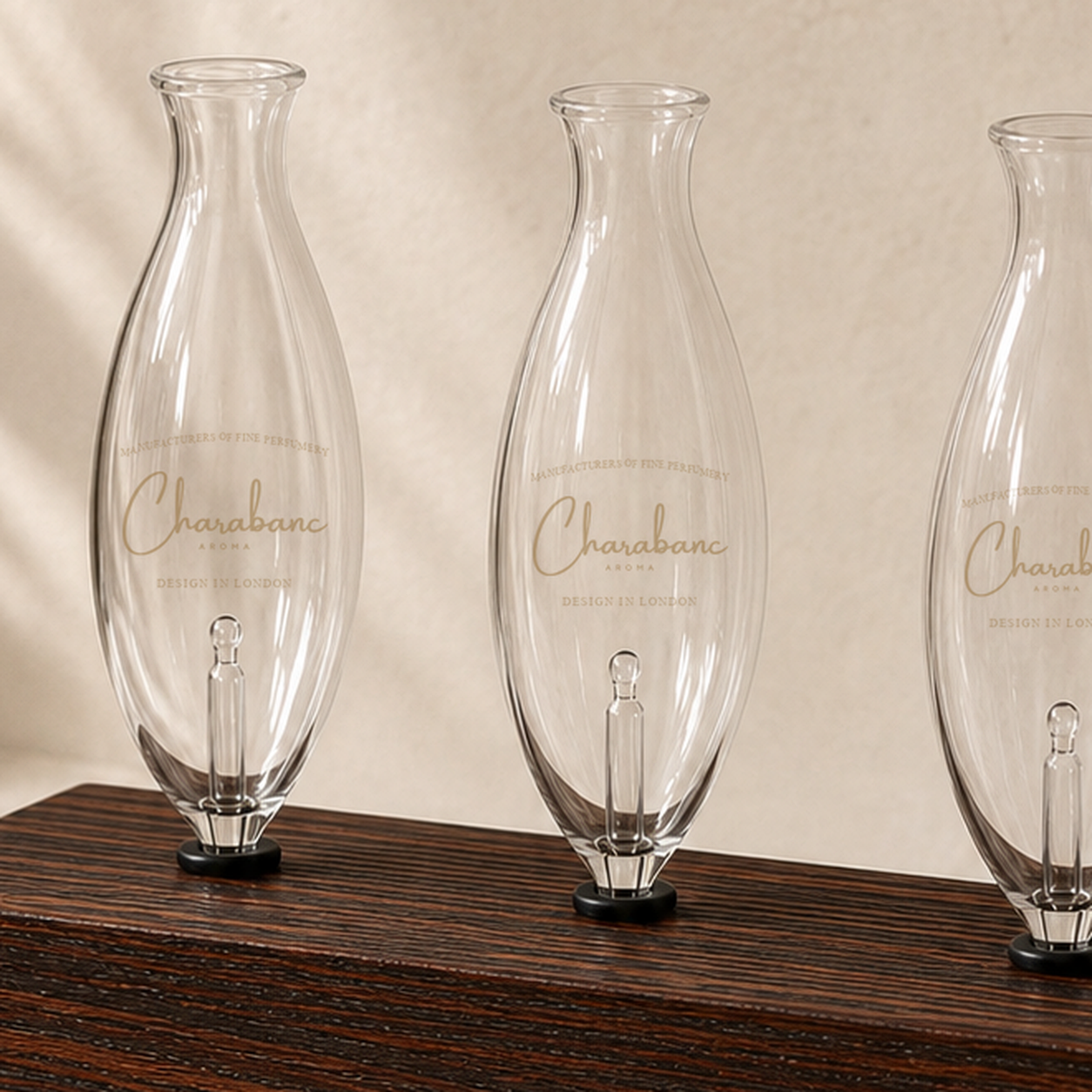 Close detail of the Heritage wood finish, Charabanc glass bulb logo, and bulb seat