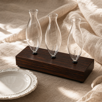 Three-Bulb Aroma Glass Rack styled on linen with three clear glass bulbs