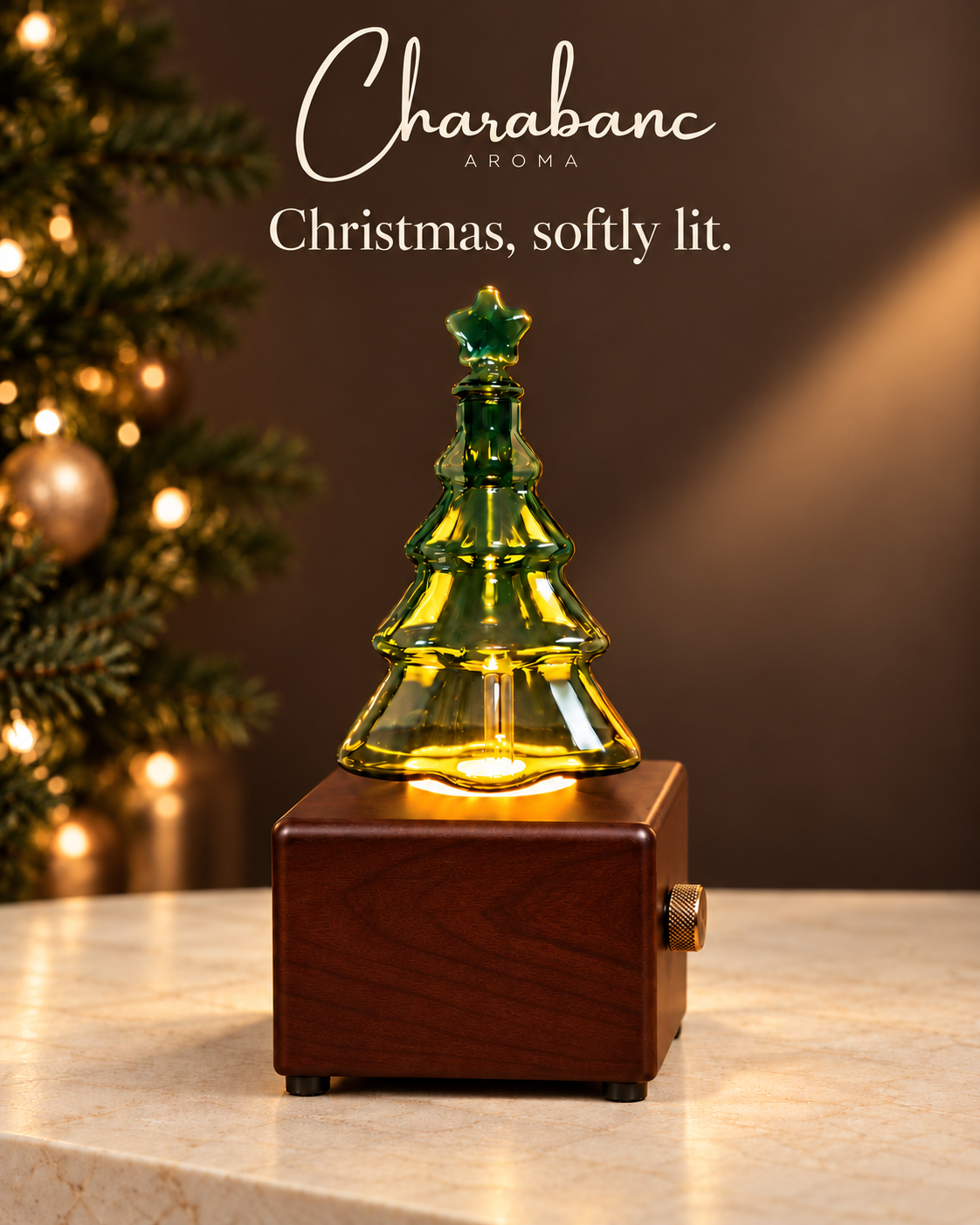 Wood-finish Christmas tree diffuser in a warm Christmas interior with Charabanc Aroma branding.