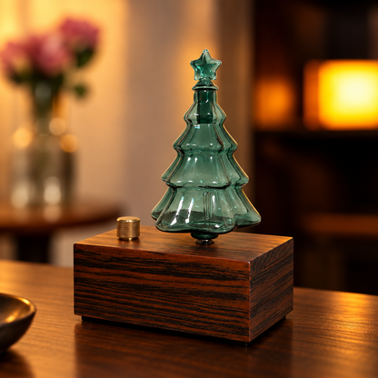 Green Christmas Tree Aroma Glass Bulb on a wooden diffuser base in a warm interior; base sold separately