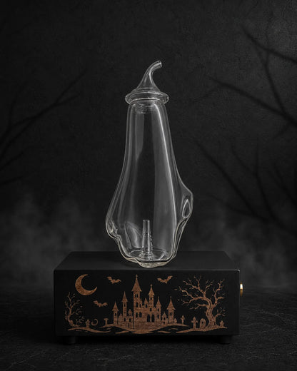 The Haunted Castle copper-engraved black MINI diffuser with blank Ghost glass bottle and fitted glass cap in a charcoal Halloween setting