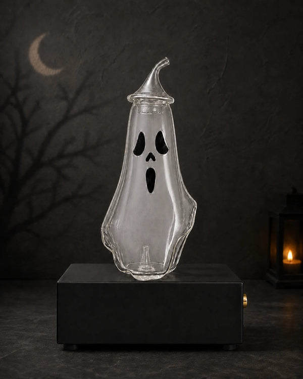 Ghost-shaped glass bottle decorated with a classic surprised face and an evenly distributed subtle aromatic mist inside