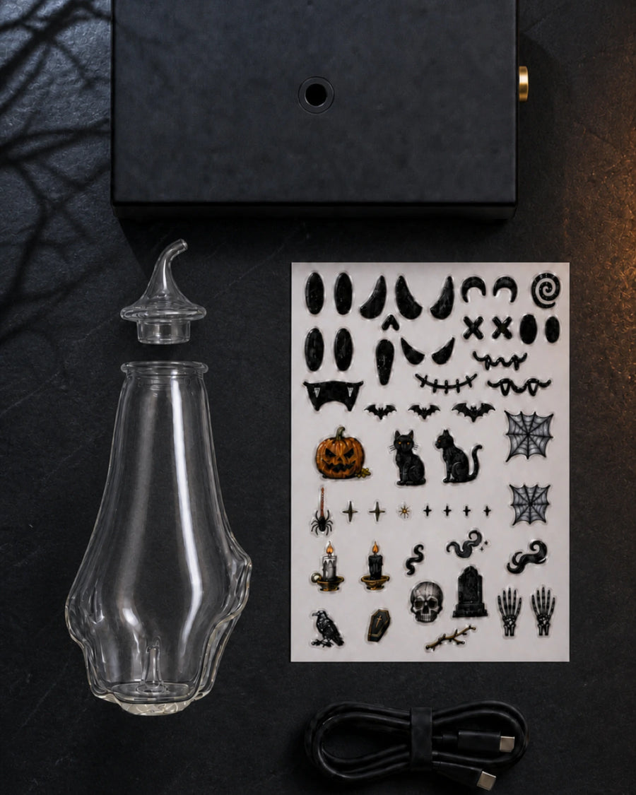 Top-down MINI Complete Set in a Halloween setting, with the removable glass cap aligned directly above the ghost bottle opening and the black rubber-ringed base opening clearly visible