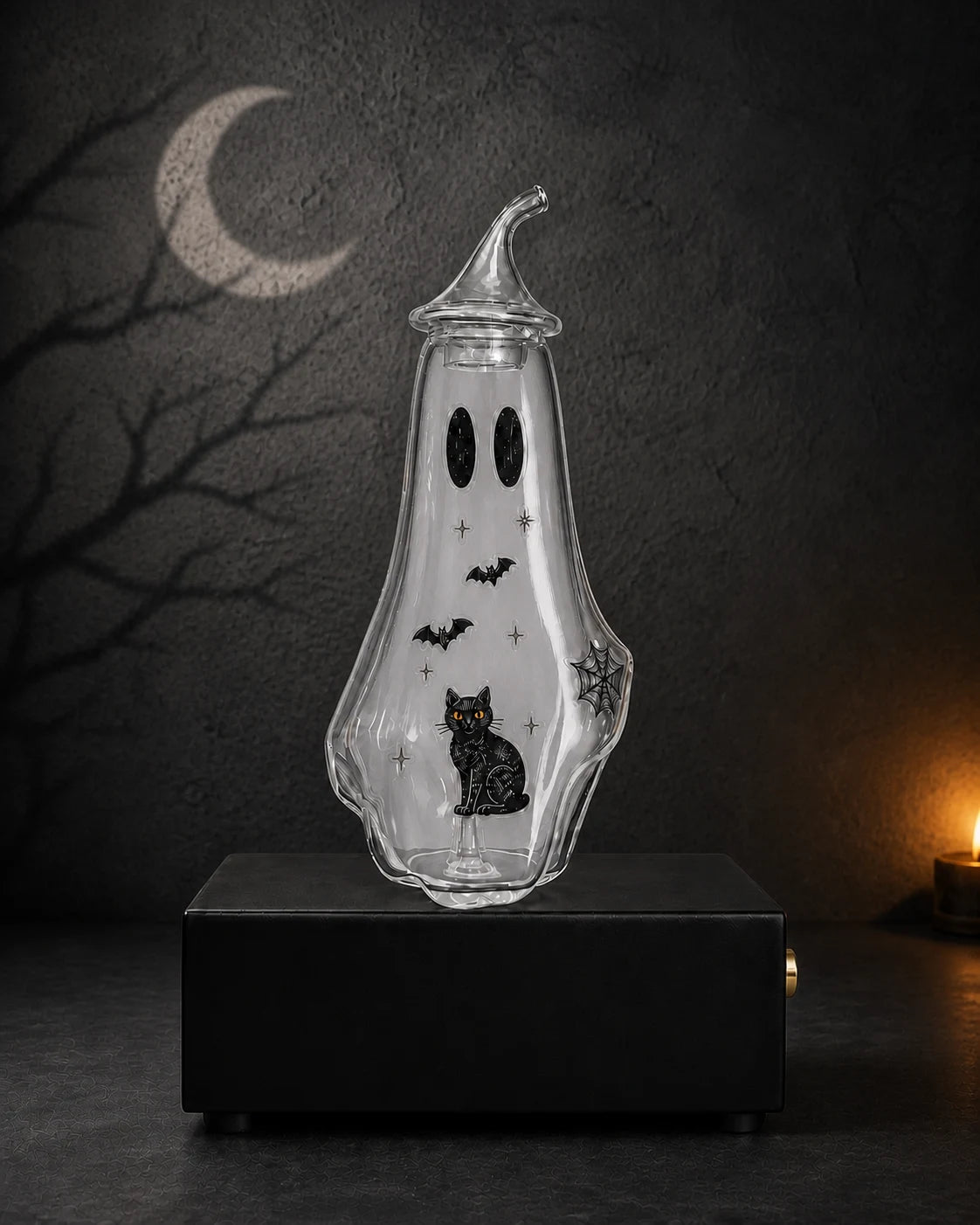 Ghost bottle decorated with black cat, bat, star, and spiderweb stickers and an evenly distributed subtle aromatic mist inside