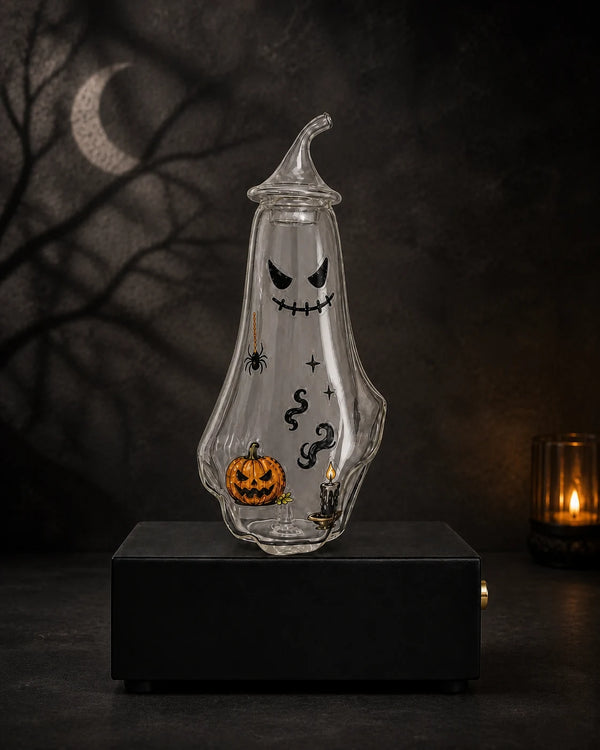 Ghost bottle decorated with pumpkin, candle, smoke, star, and spider stickers and an evenly distributed subtle aromatic mist inside
